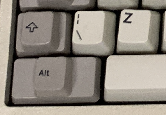 tiny left shift, backslack key next to it, shift and alt have small bumps for actual keypresses