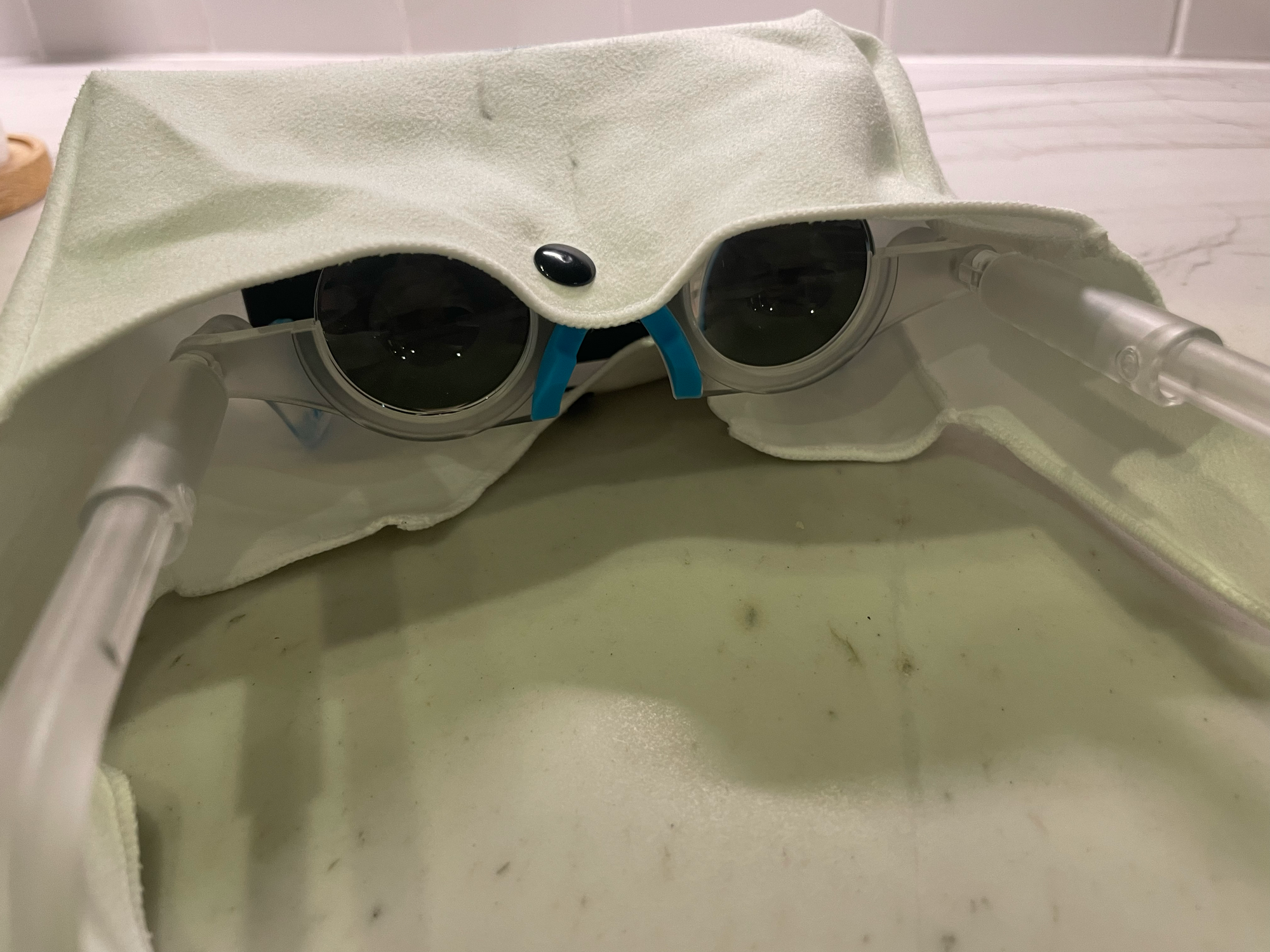 cloth cover over glasses, camera angle showing lenses