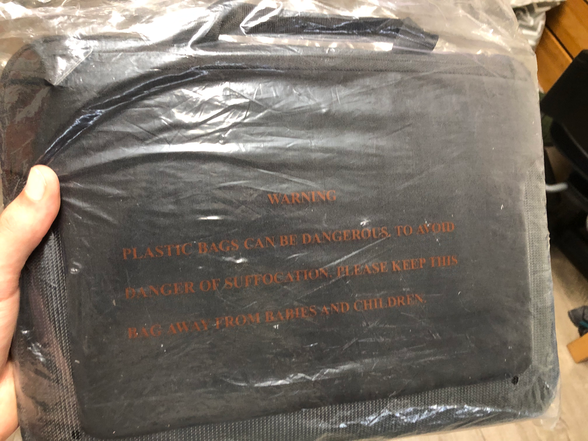 LEVEL8 Atlas bag in plastic wrap with suffocation warning displayed